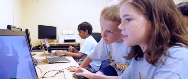 Kids working together on a coding activity